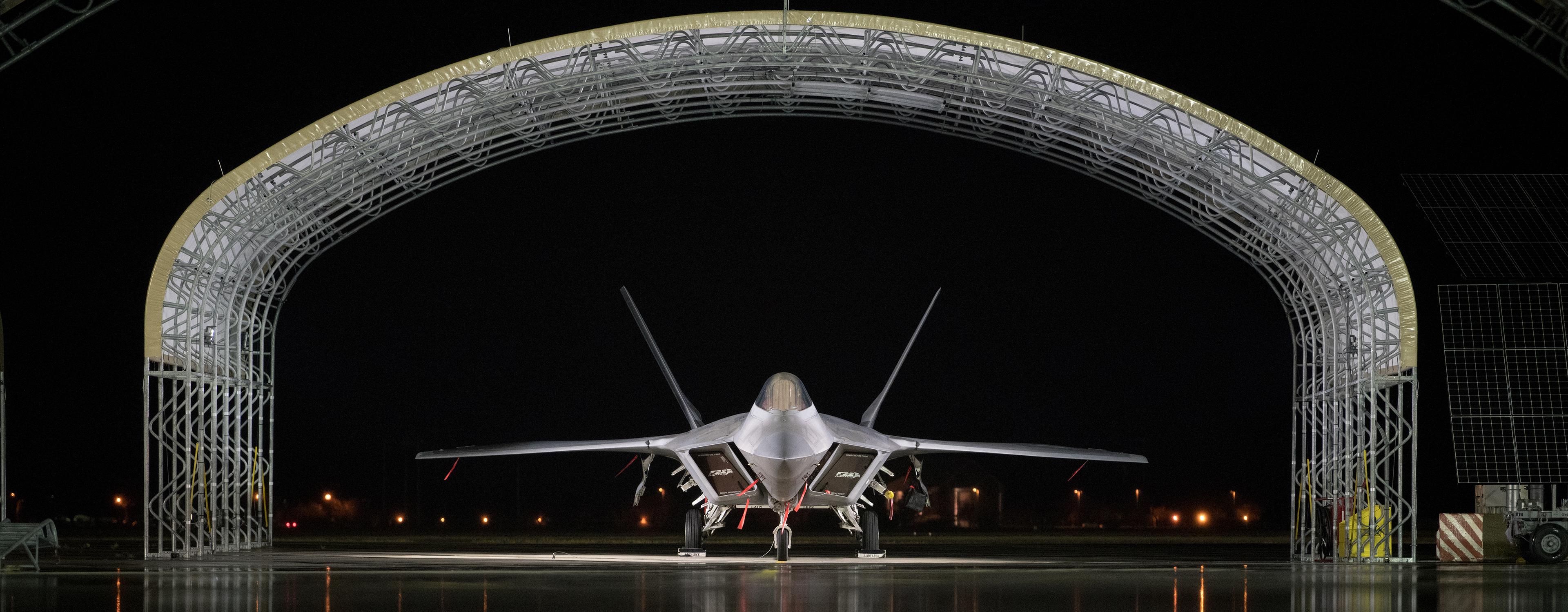 F-22 Raptor lit at Night under Sun Shade